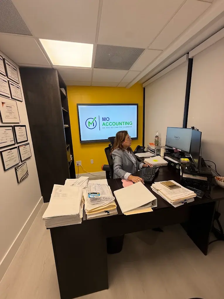 Martha Otalora at her desk in the MO Accounting Services office